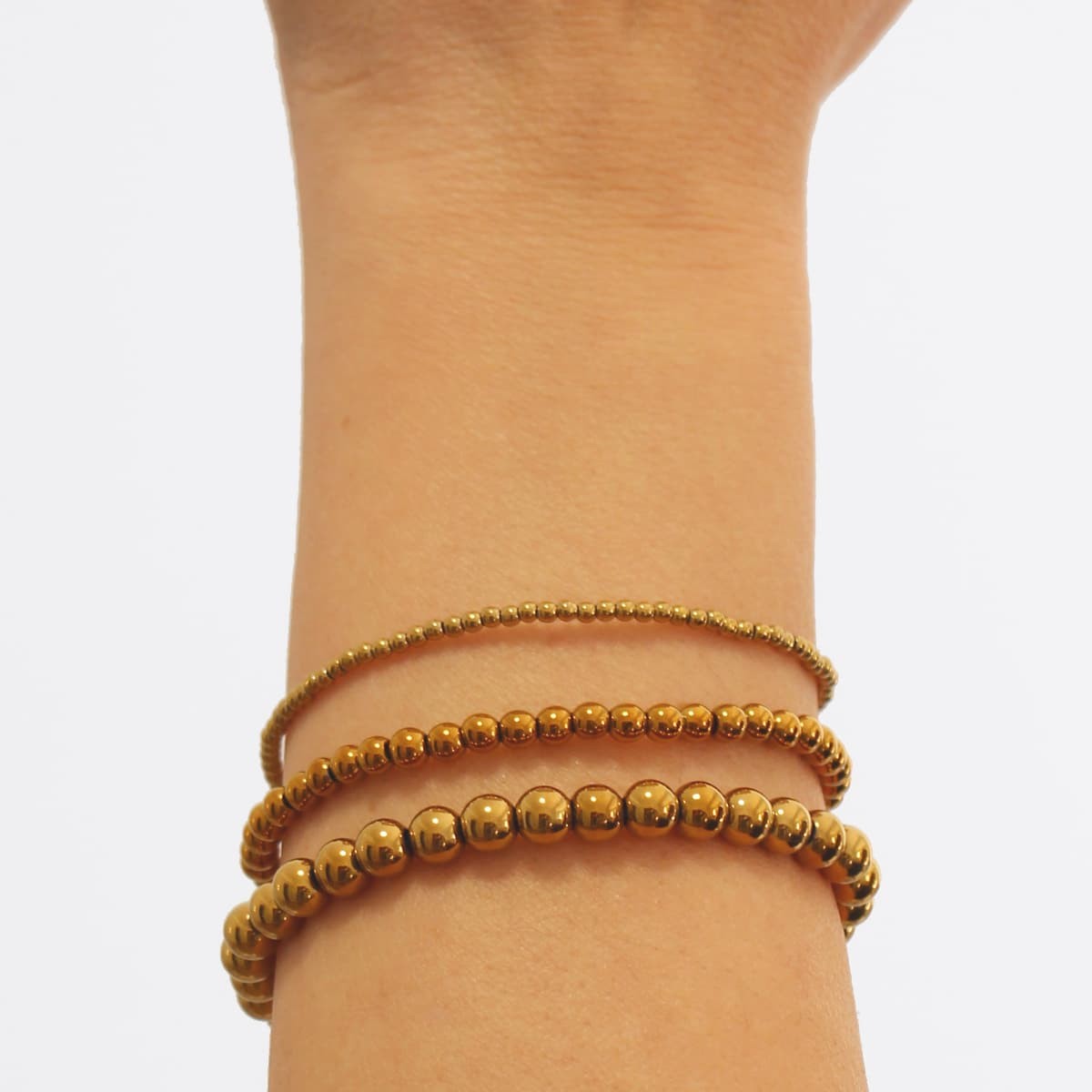 Pulsera bolitas BPU619 oro elástica hematita plata anartxy