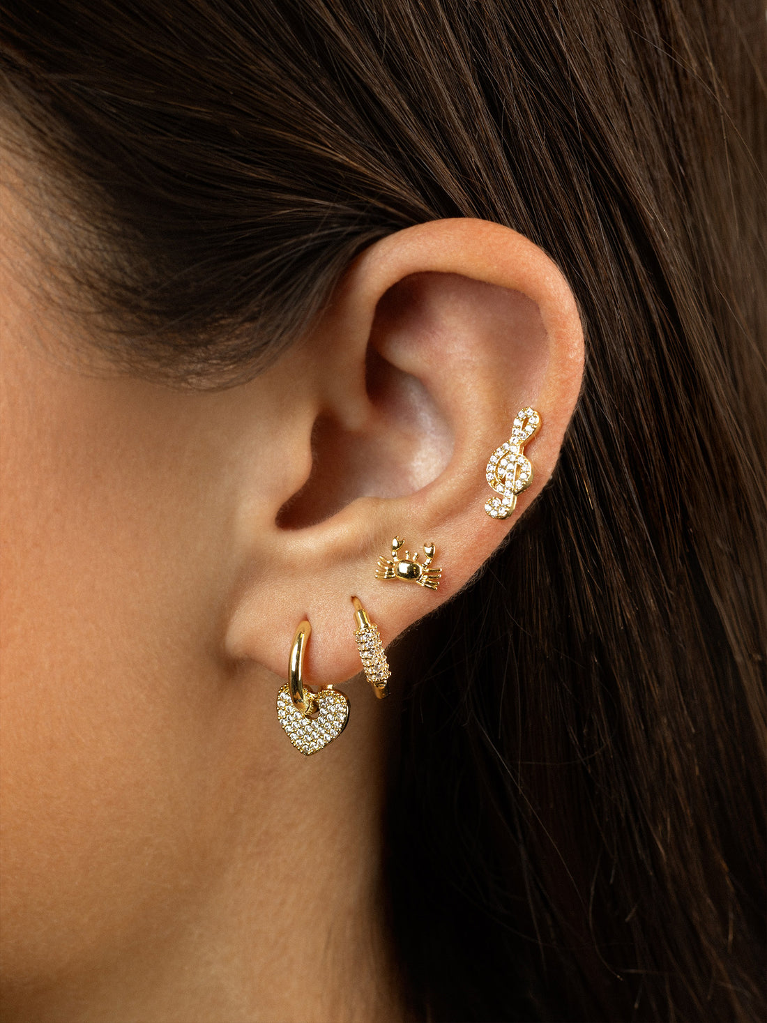 Piercing clave de sol circonitas Dorado Anartxy